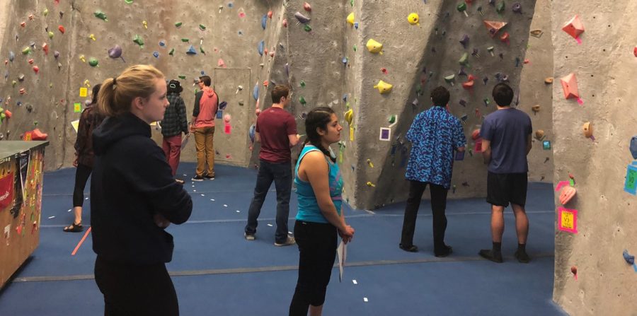 Climbers+plan+their+routes+at+UWLs+Back+to+the+80s+Bouldering+Competition