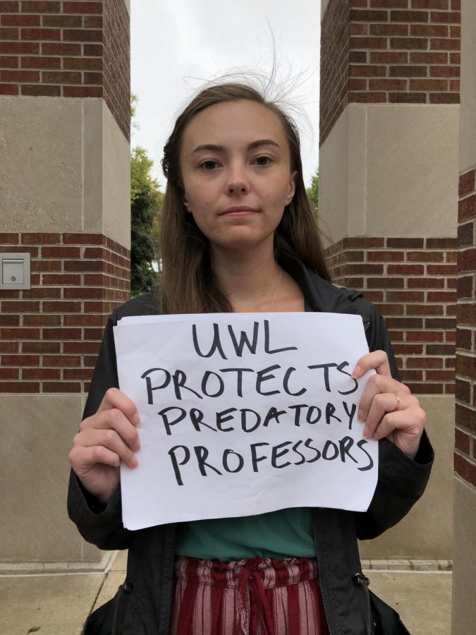 UWL Senior Kendra Whelan protesting by Hoeschler Clock Tower