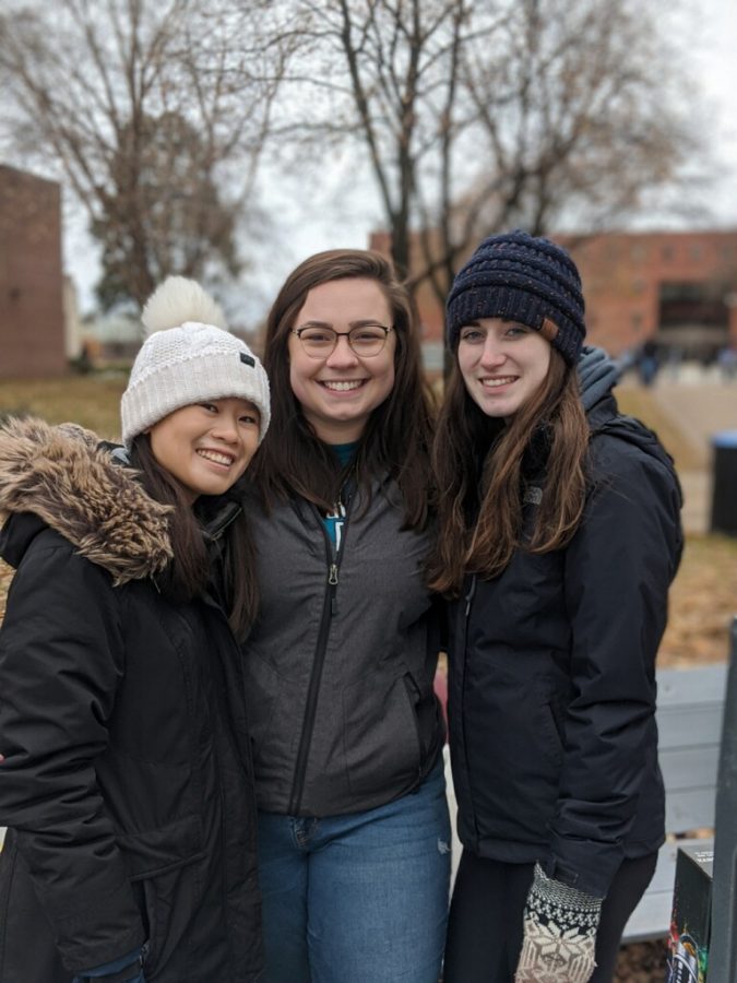 Members of Student Philanthropy Council table by the Hoeschler Tower. From left to right, Aliyah Grote-Hirsch. Hana Church, and Koehler Gerlach.