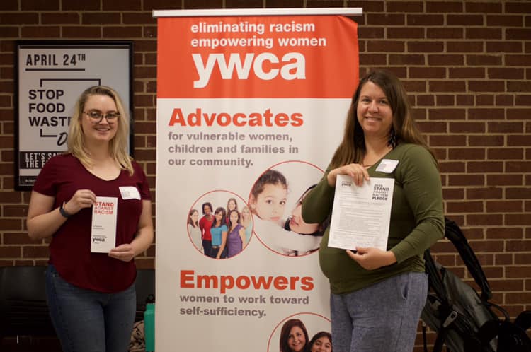 Jane Benzschawel (right) and UWL student Giorgia Brennan (left) hand out pamphlets for the YWCA.