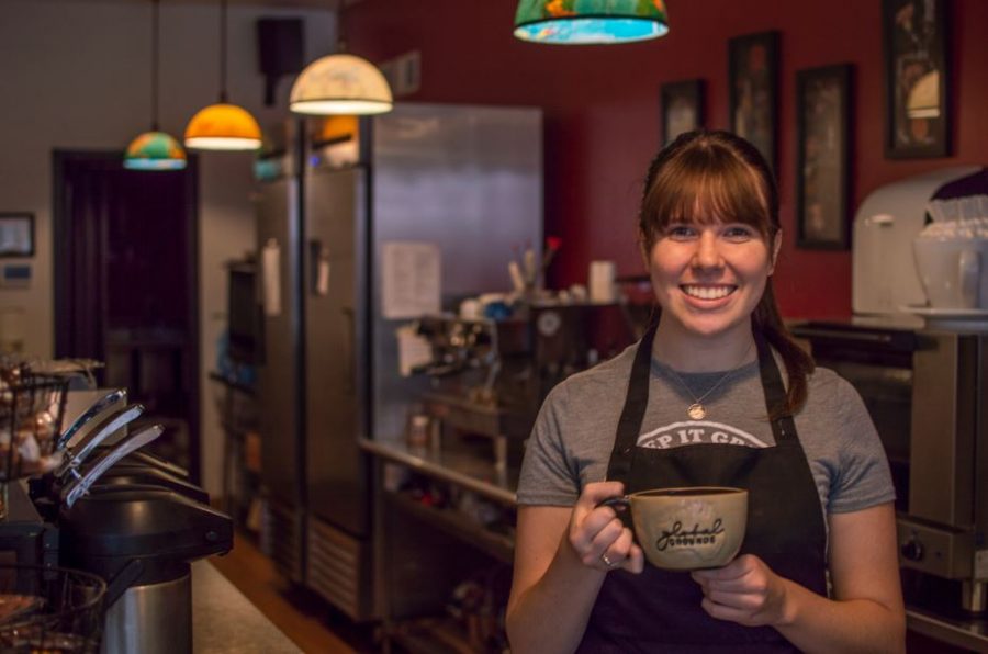 UWL Senior Peyton Medick poses with a cup of coffee at Global Grounds.
