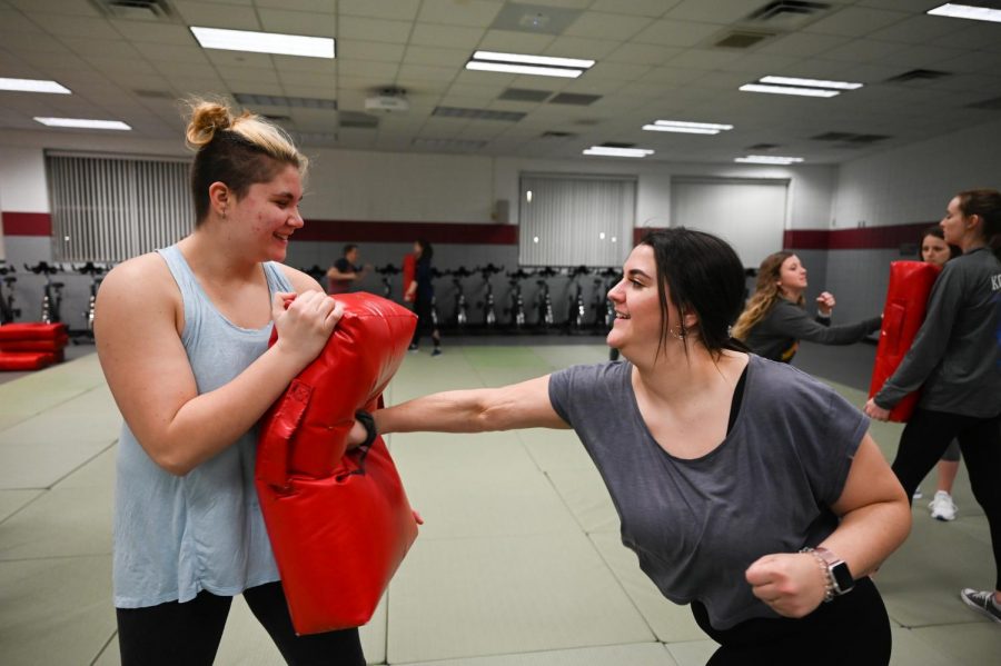 Students learning defense tactics in self-defense class. Photo taken by Carly Rundle-Borchert.