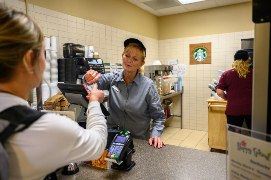 Tammy Larkin (left) and Lisa Kumm (right) working in the Starbucks located in Centennial Hall.