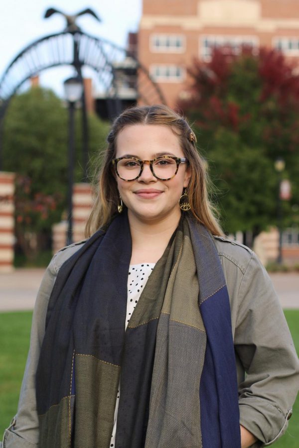 A photograph of Cassie Davis. She is smiling while looking into the camera.