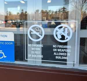 Signage prohibiting firearms outside of Eagle Recreational Center. Photo taken by Jackson Skarp. 