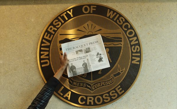 General Assignment Reporter Hephzibah Ohihoin holds the paper over UWLs official logo. Photo taken by Isabel Piarulli. 