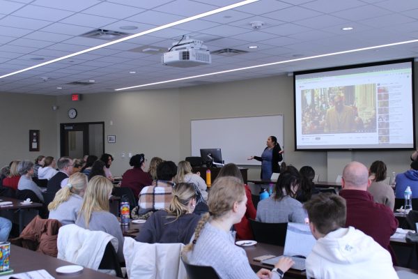 Dr. Dina Zavala presenting to an audience of students, staff and faculty.

Photo taken by Sophie Miller. 