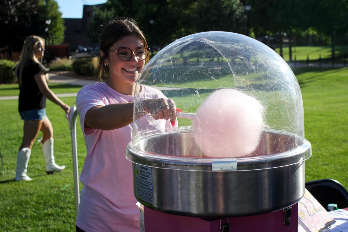 Club at Eagle Fest making cotton candy. Photo taken by Trinity Rietmann. 