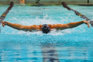 UWL Swimmer competes in the Butterfly. Photo by John Gaynor. 