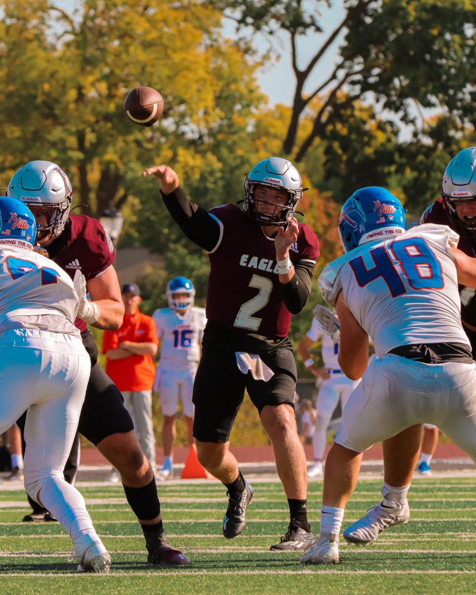 Kyle Haas throws a pass.