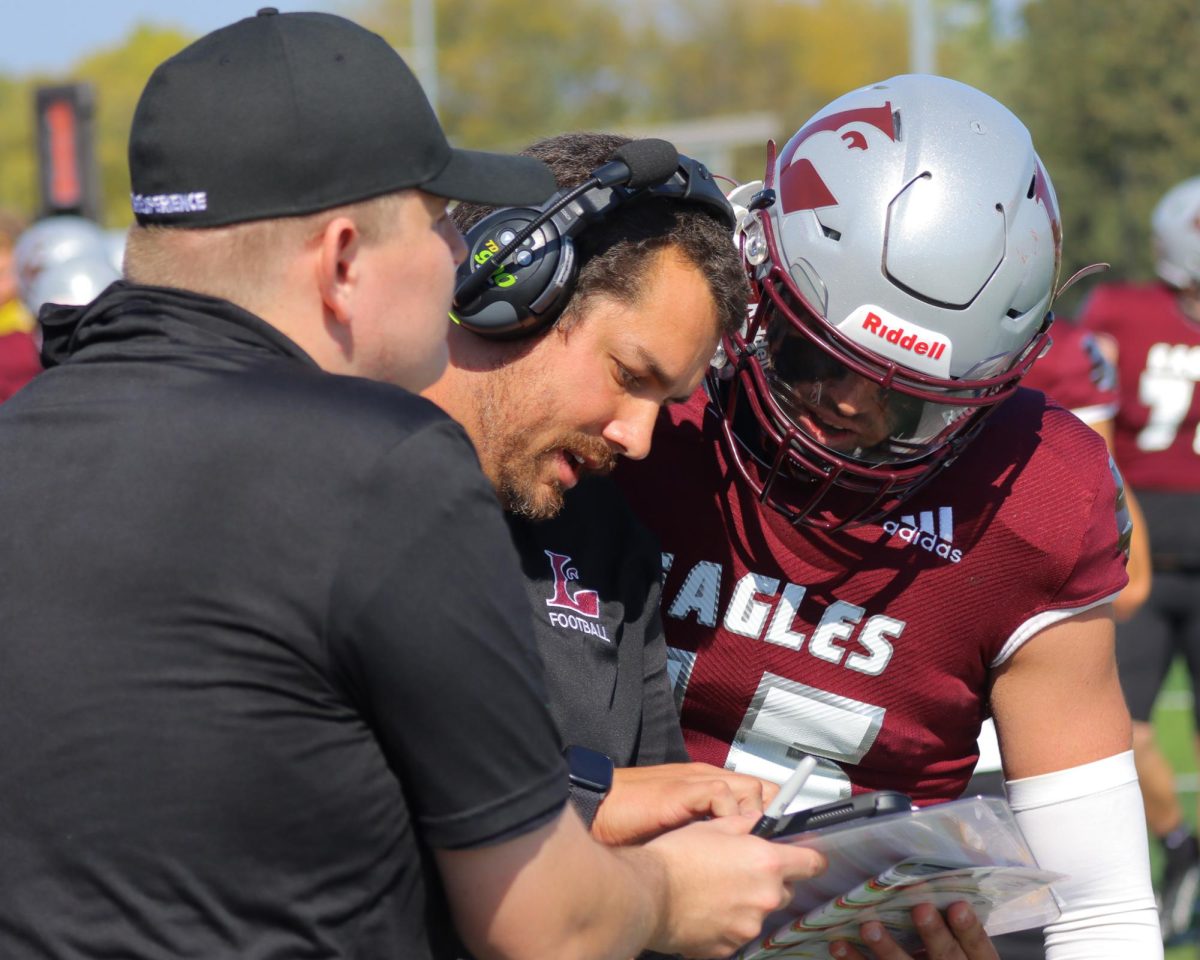 UWL Football Head Coach Matt Janus discussing strategy.