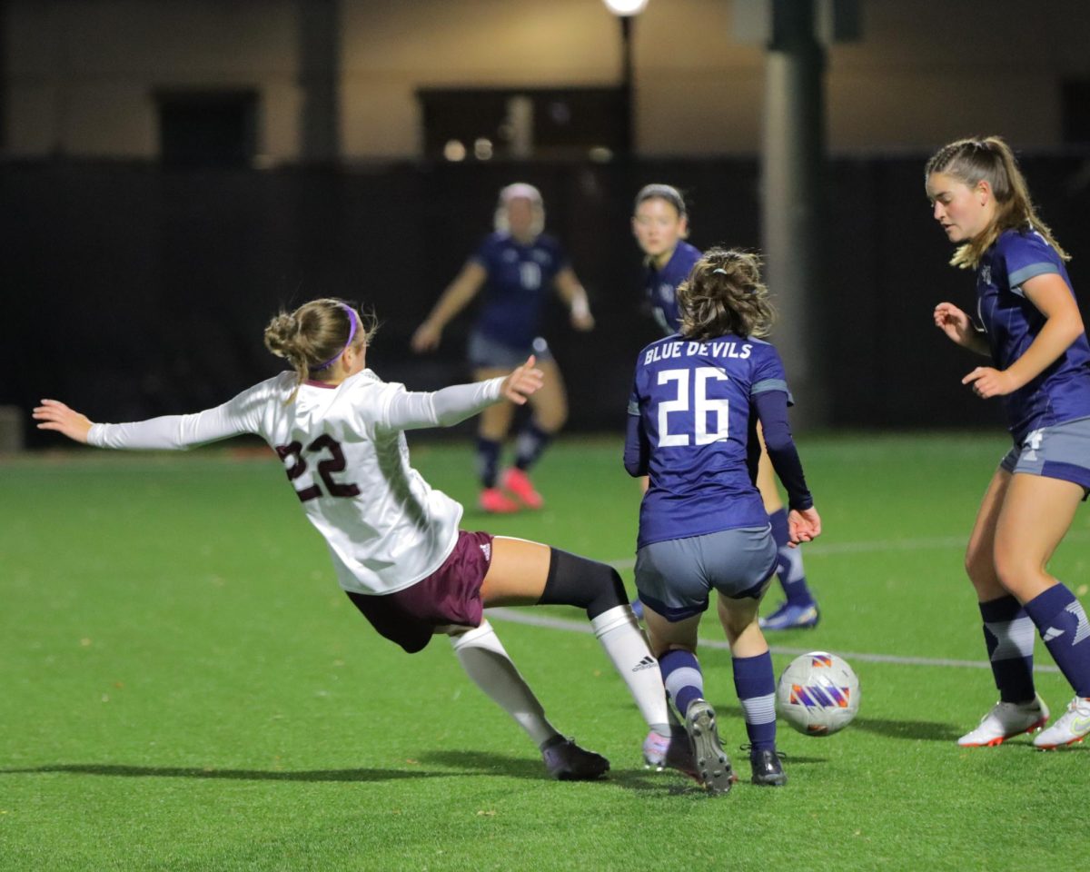 Sydney Prybylla attempts a slide tackle. Photo by John Gaynor. 