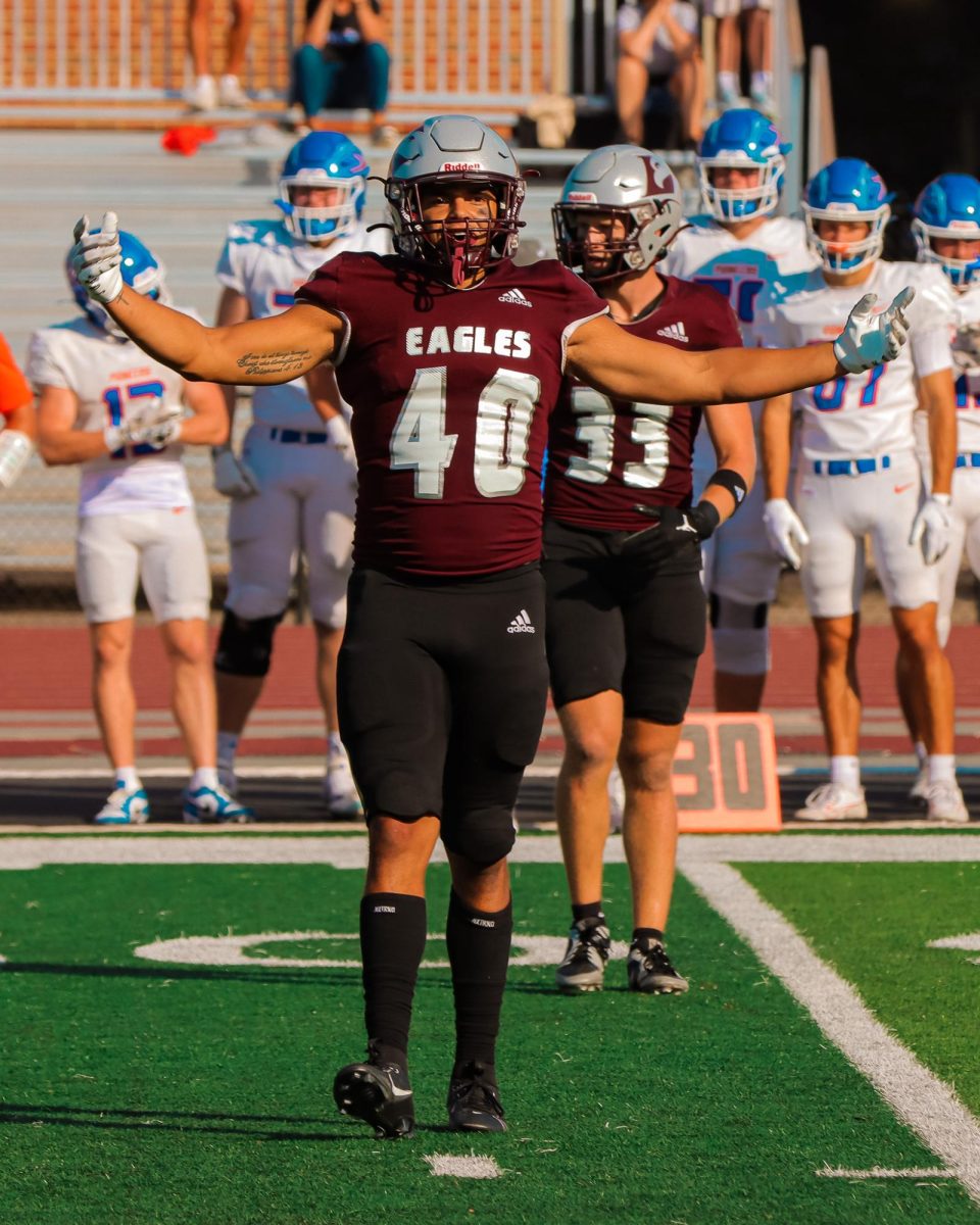 Austin Knade hyping up the crowd before 3rd down. 