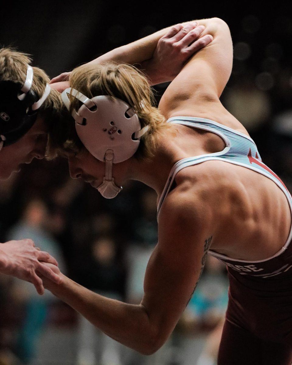 UWL Wrestler fights for position.