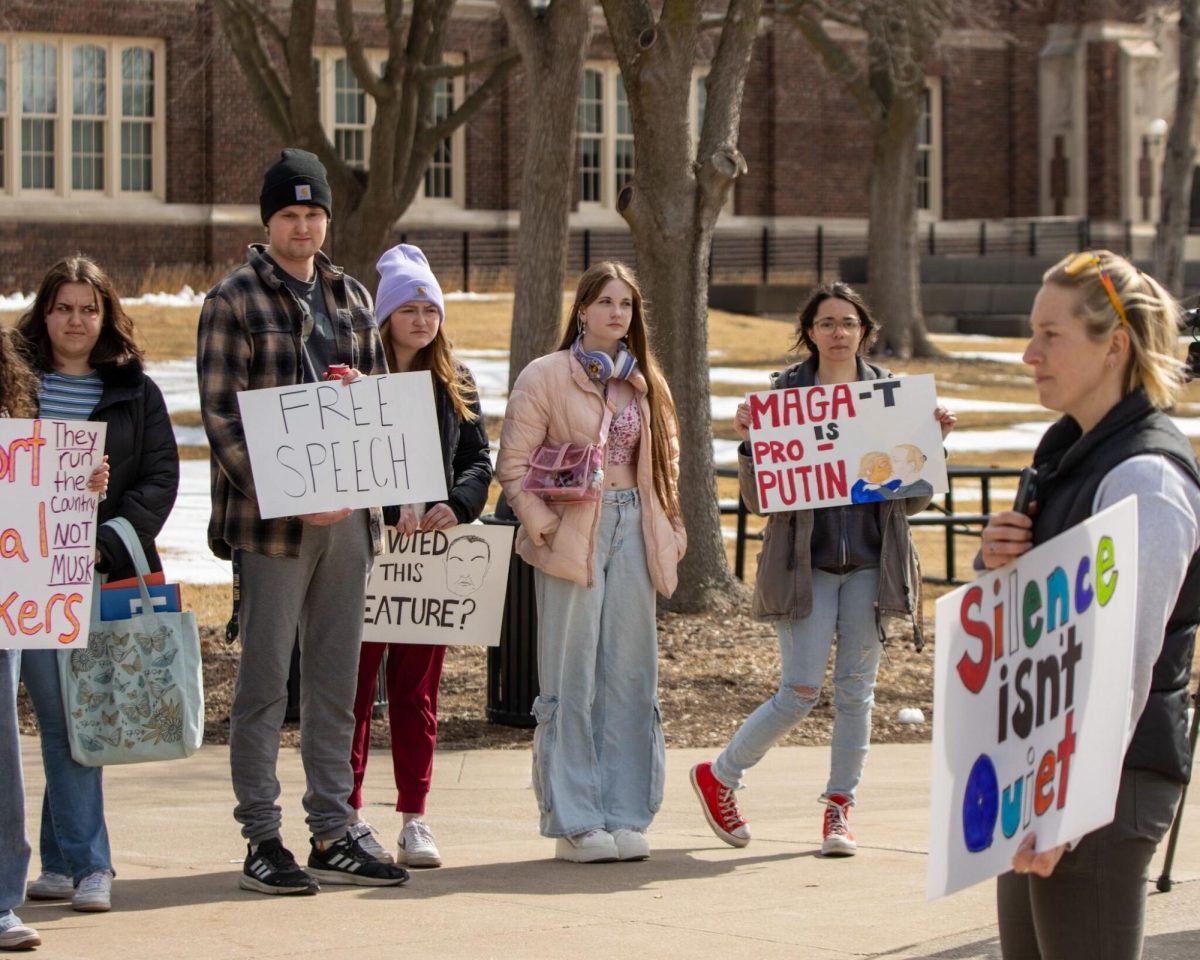 Students holding signs at the demonstration. Photo taken by John Gaynor. 