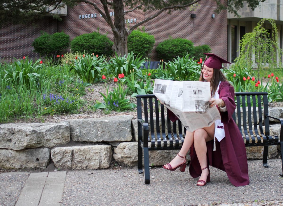 Ellie Davis with the April Edition of The Racquet Press. Photo by Trinity Rietmann. 