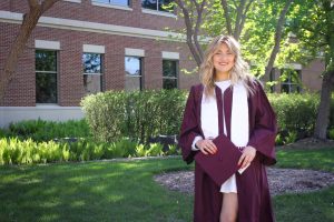 Claire Esser, graduating newspaper designer. Photo by Trinity Rietmann.