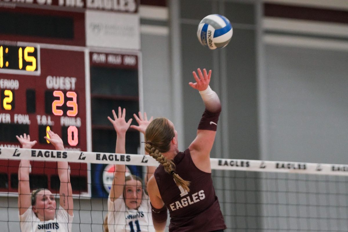 Grace Nommensen attempts a kill during a game against The College of St. Scholastica on Friday, September 12. Photo by John Gaynor.