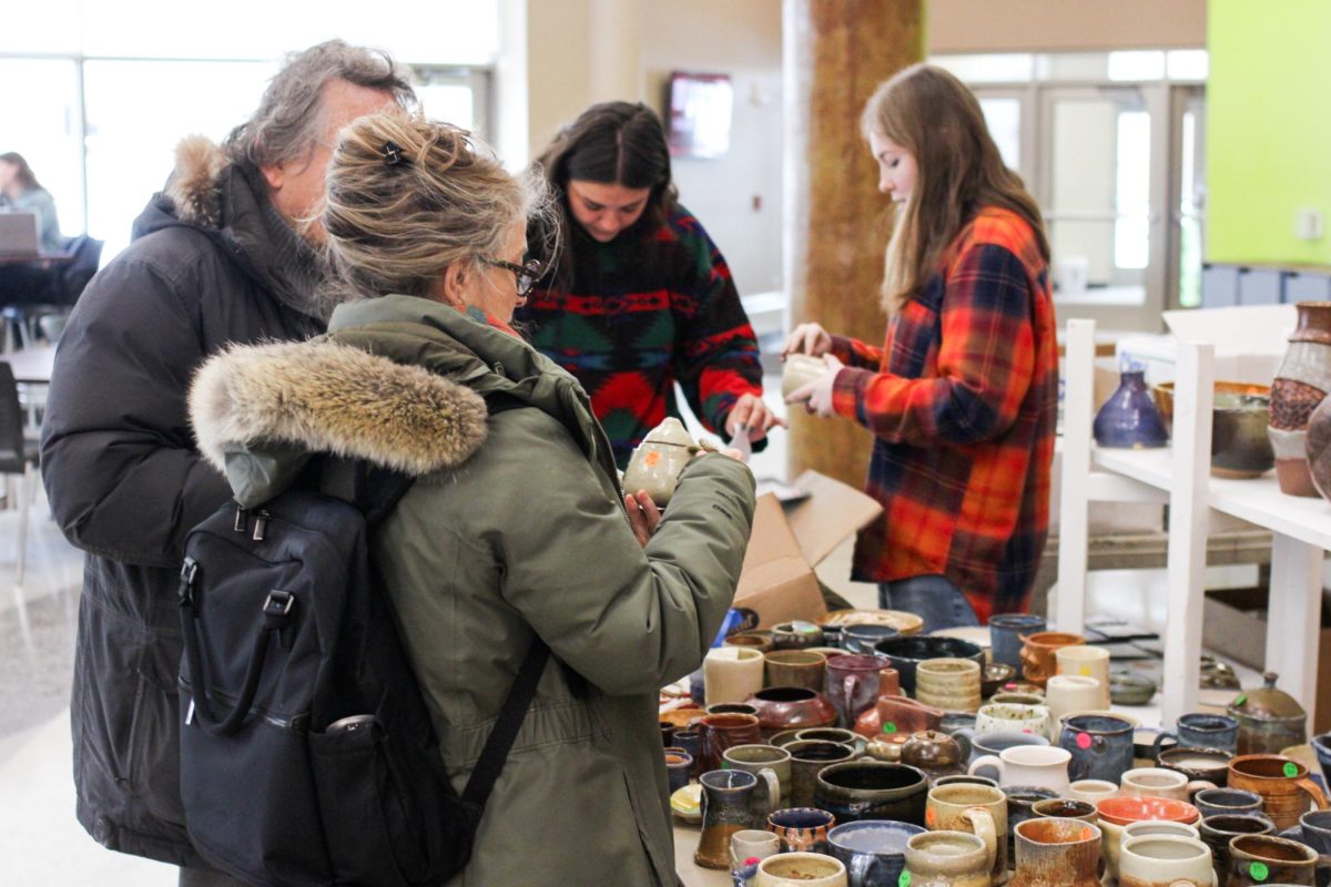 People browsing the ceramics sale. Photo by Trinity Rietmann.