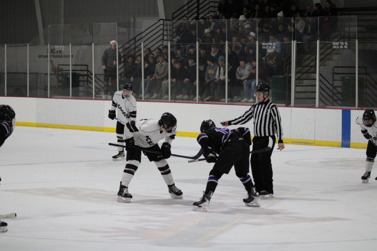 UWL and Waldorf players preparing for a face off. Photo by Colin Cronan. 