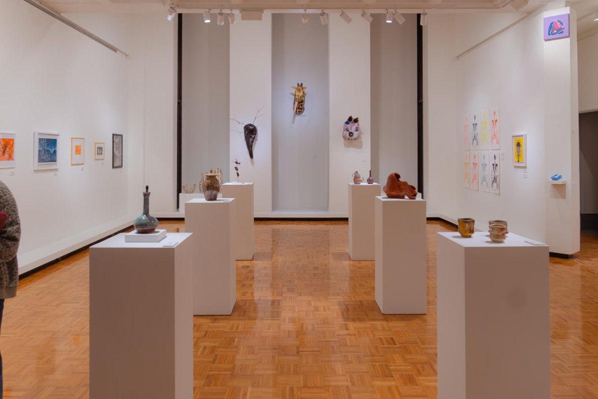 Students art displayed on the gallery floor. Photo by Sam Hall. 
