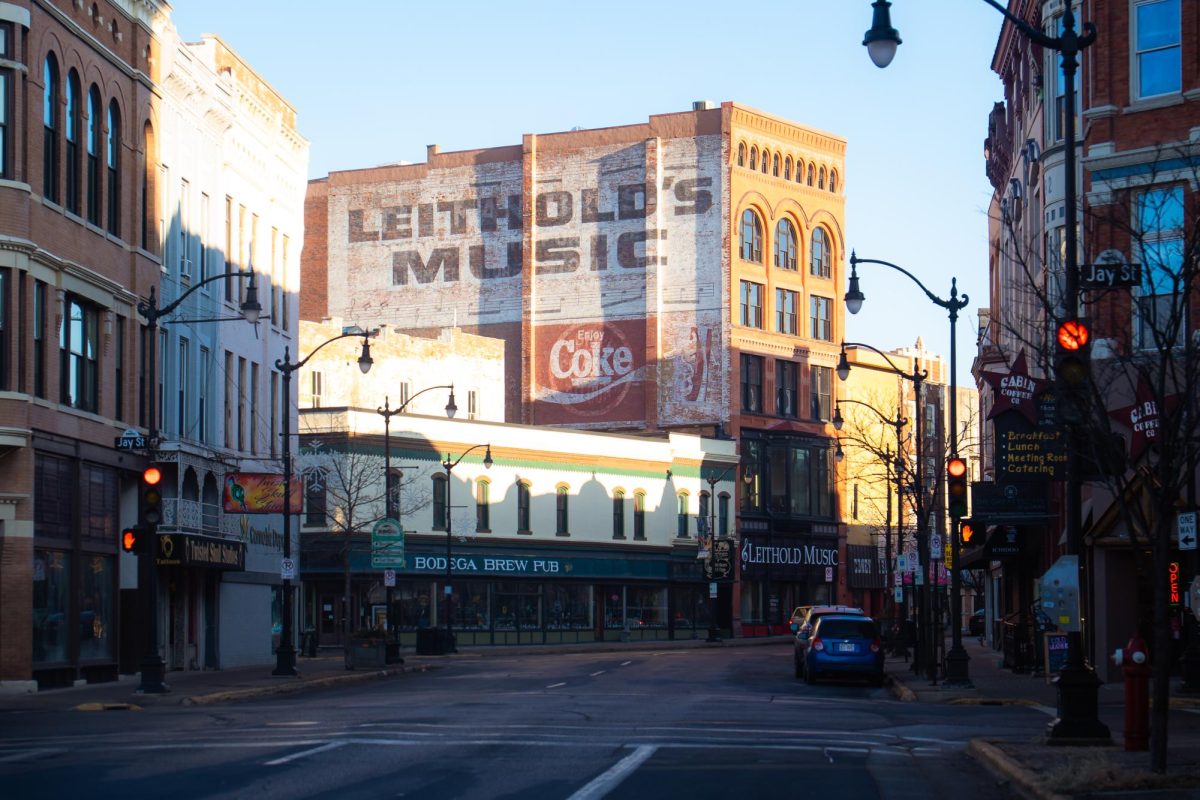 A “ghost sign” advertising Leithold’s Music and Coca-Cola on a downtown building along Fourth Street. Photo by Sam Hall.
